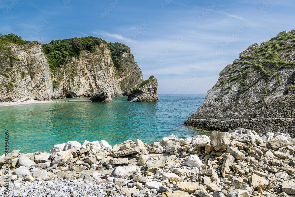 Fototapeta premium The beach and the cliffs on the island of St. Nicholas in Budva,