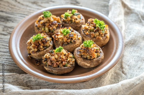 Mushrooms' caps stuffed with mixture of cheese, onion, breadcrum
