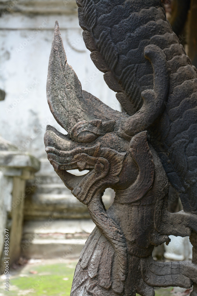wood carved Naka in Shwenandaw Kyaung Temple or Golden Palace Monastery in Mandalay, Myanmar. wood carved Naka in Shwenandaw Kyaung Temple or Golden Palace Monastery in Mandalay, Myanmar.