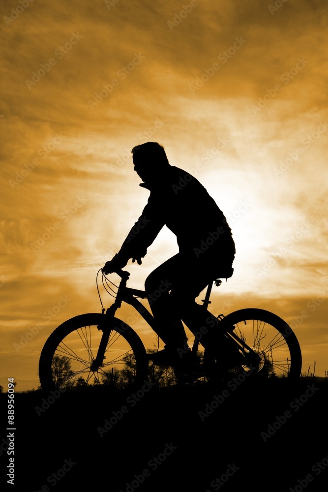 Obraz premium Sunset Biker Silhouette