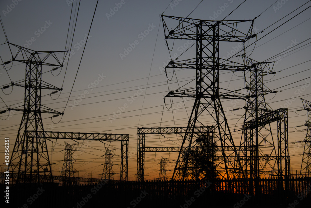 Electricity poles at sunset in Soweto, a township of Johannesburg in South Africa. 

