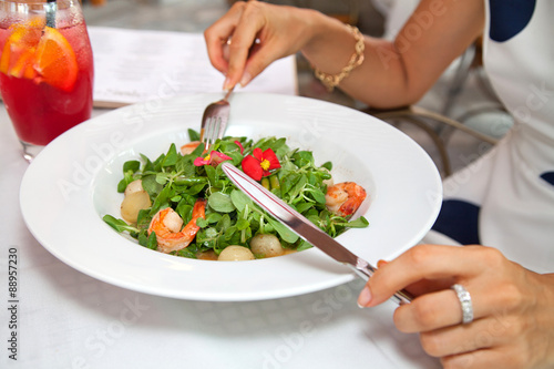 woman eating green healthy salad