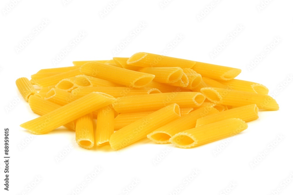 Pile of uncooked dry penne pasta isolated on a white background Pile of uncooked dry penne pasta isolated on a white background