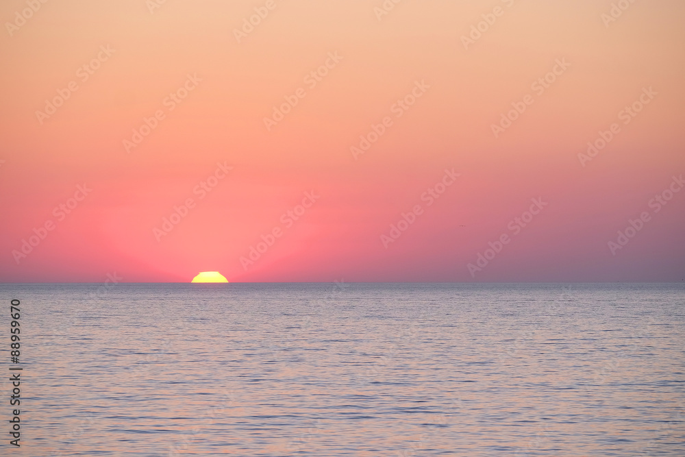 Obraz premium Landscape with the image of a sea sunset