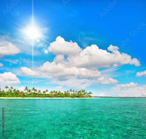 Fototapeta Naklejka Na Ścianę i Meble -  Tropical beach with palm trees and sunny blue sky