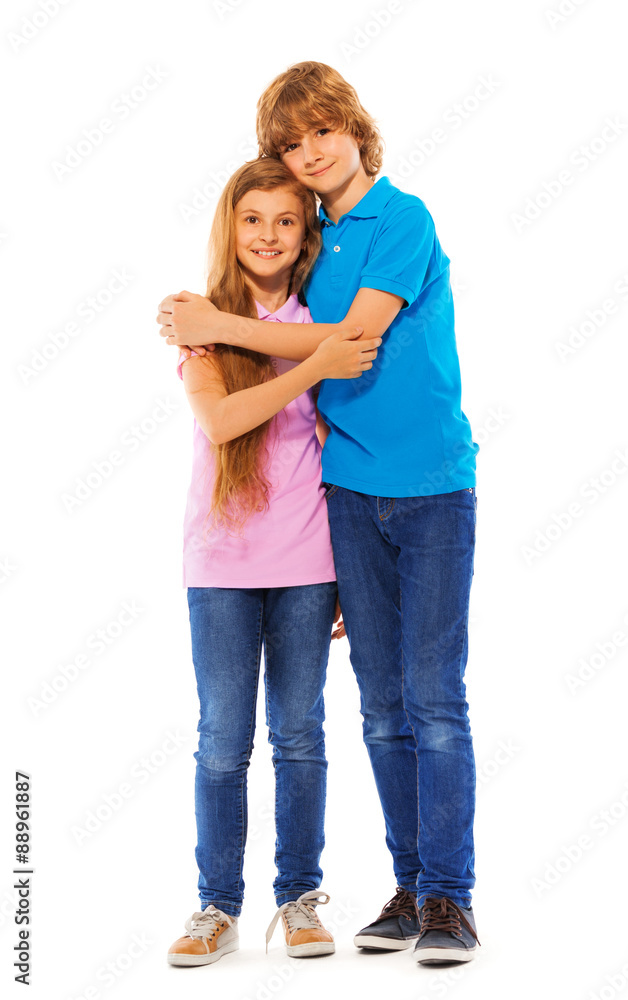 Two siblings boy and girl on white portrait Two siblings boy and girl on white portrait