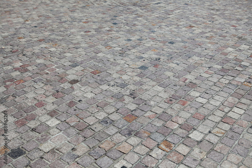 Fototapeta premium Street stone block pavement texture and background