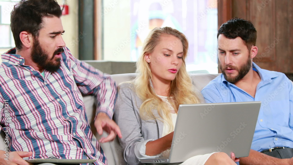 Casual business team having a meeting on the couch Casual business team having a meeting on the couch