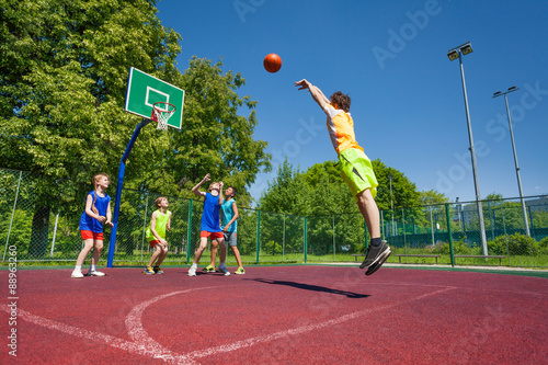 Boy performs foul shot at basketball game