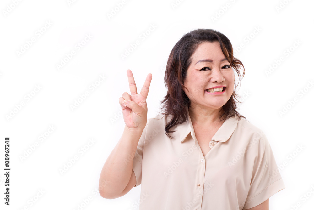 happy, confident middle aged woman pointing up v sign, victory, happy, confident middle aged woman pointing up v sign, victory,