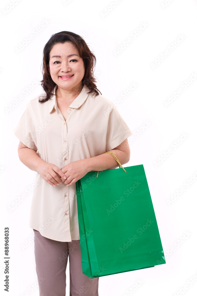 happy middle aged asian woman with shopping bag happy middle aged asian woman with shopping bag