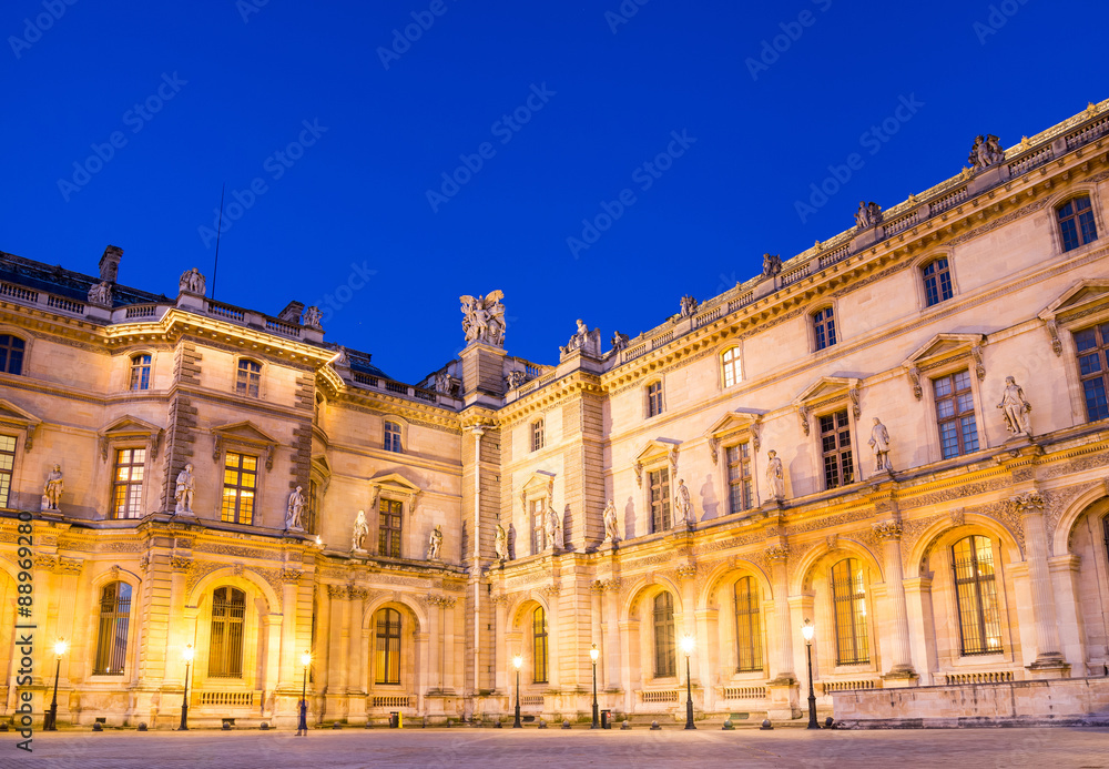 Paris - June 18: Louvre museum at dusk on June 18, 2014 in Paris
