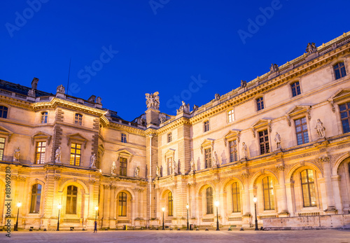 Paris - June 18: Louvre museum at dusk on June 18, 2014 in Paris