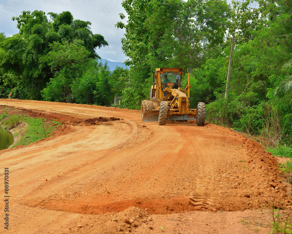 large grader a narrow rural road large grader a narrow rural road
