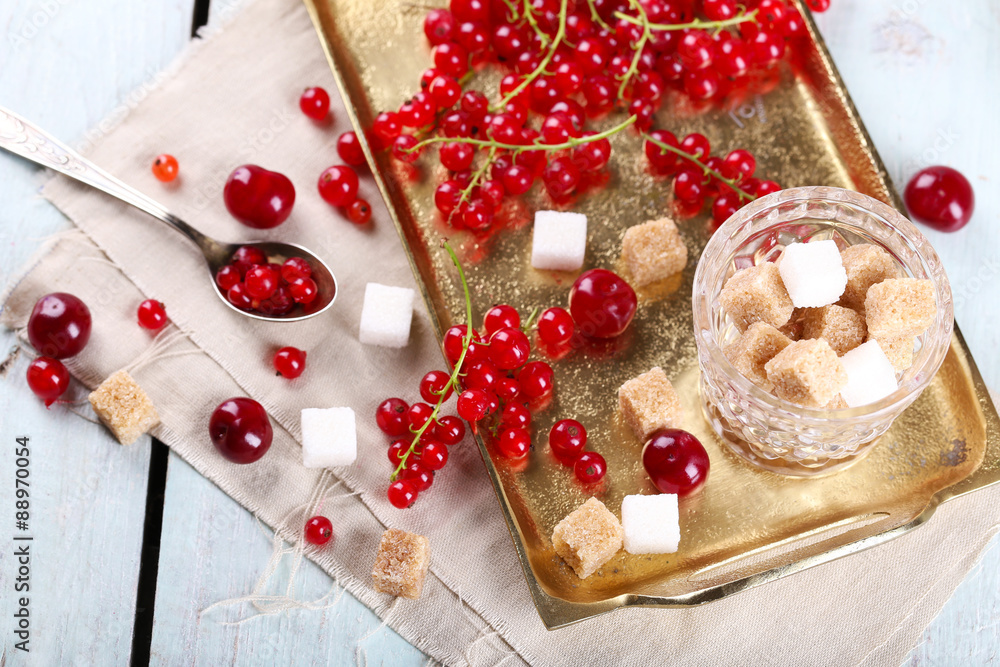 Fresh red currants with sugar on table close up Fresh red currants with sugar on table close up