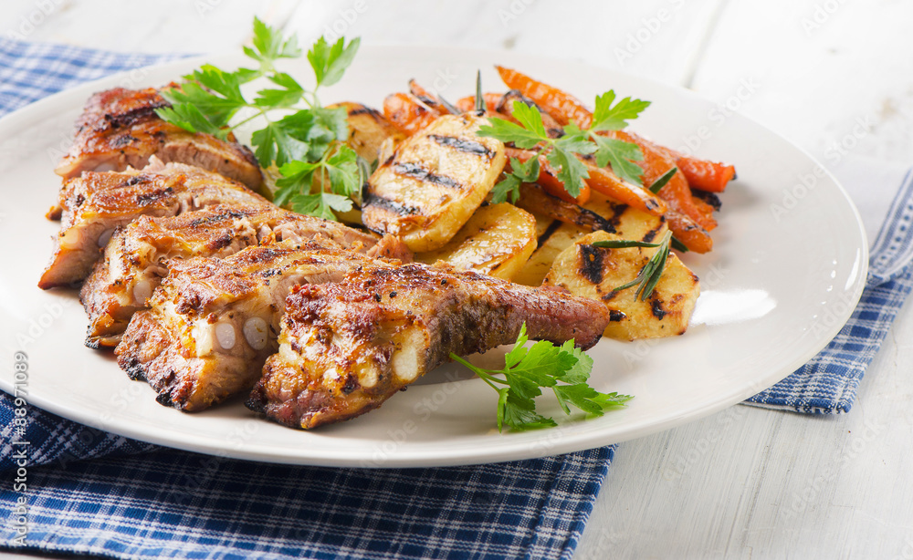Grilled Pork Ribs and Vegetables on a Plate.