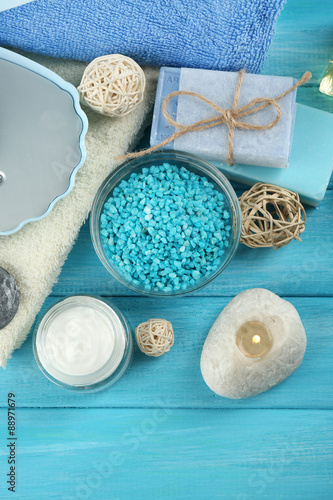 Canvas Print Spa stones and spa treatments on color wooden background