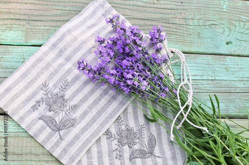 Fototapeta Naklejka Na Ścianę i Meble -  Aroma bouquet of lavender on sack and wooden background