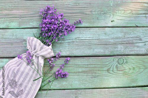 Fototapeta Naklejka Na Ścianę i Meble -  Aroma bouquet of lavender in sack on wooden background
