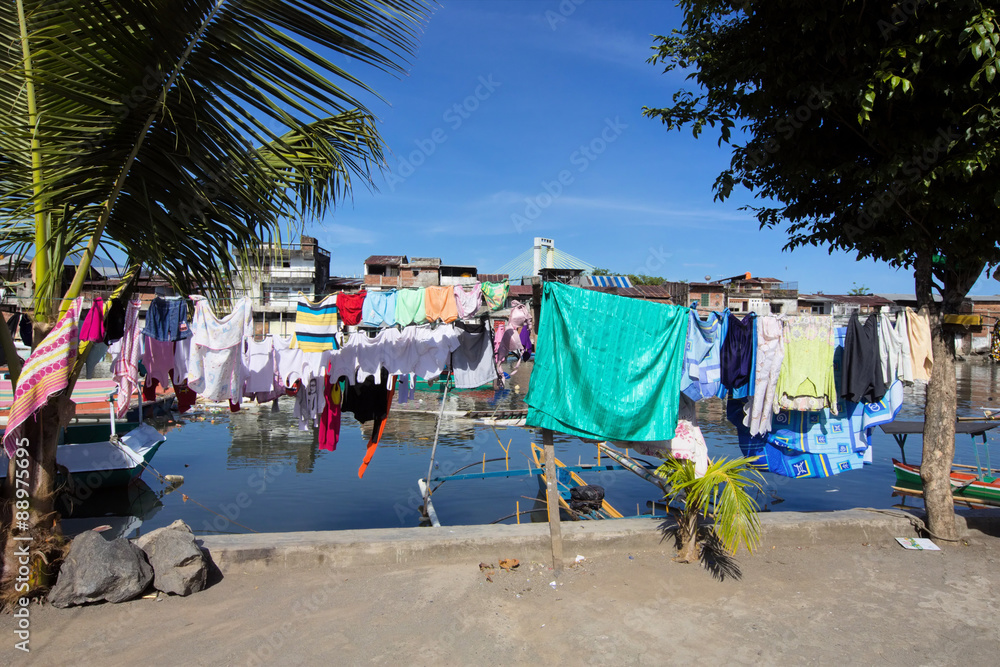 Drying laundry by the river, Manado, Sulawesi, Indonesia