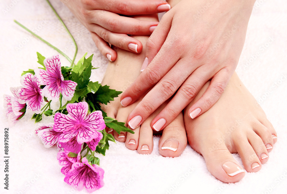 Fototapeta premium Beautiful feet with perfect spa french nail pedicure