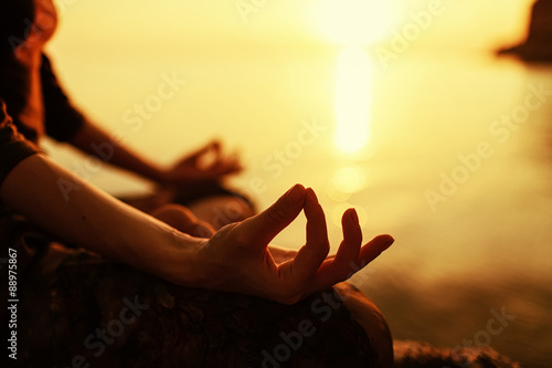 Fototapeta serenity and yoga practicing at sunset, meditation