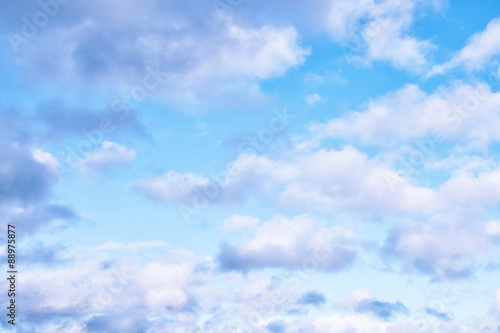 Delicate Blue Sky Background in Pastel Shades with White Clouds