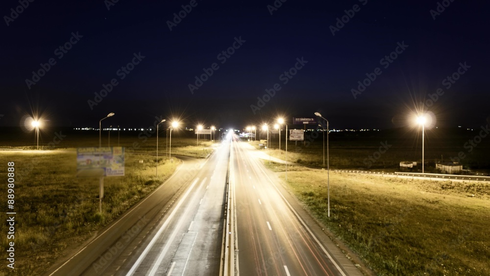 Speed Traffic at Sundown Time - light trails on motorway highway at night
Speed Traffic at Sundown Time - light trails on motorway highway at night