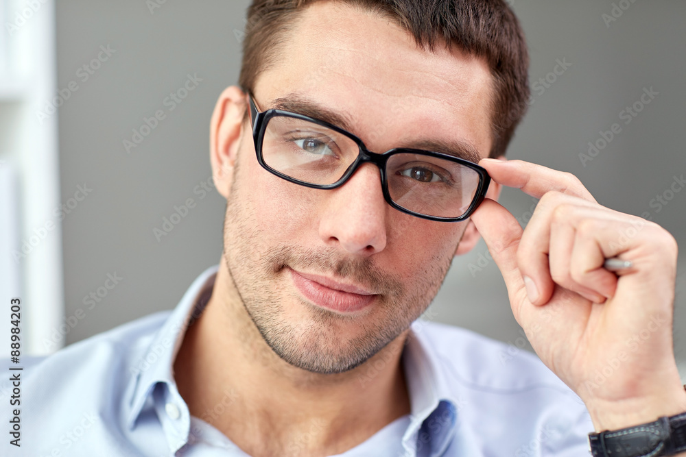 portrait of businessman in eyeglasses at office portrait of businessman in eyeglasses at office