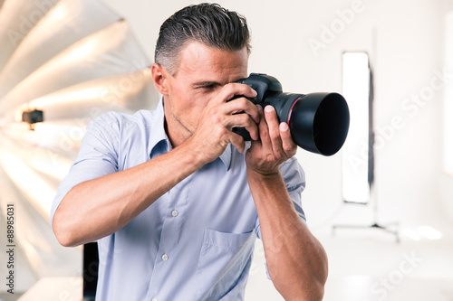 Photographer making photo on camera