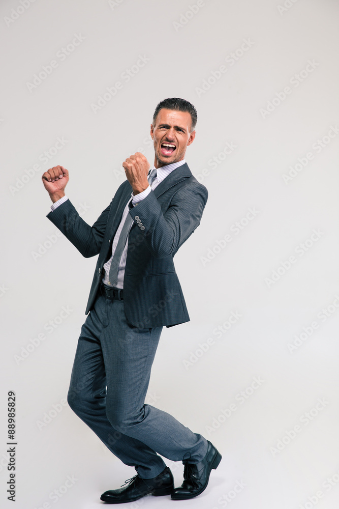 Handsome businessman celebrating his victory Handsome businessman celebrating his victory