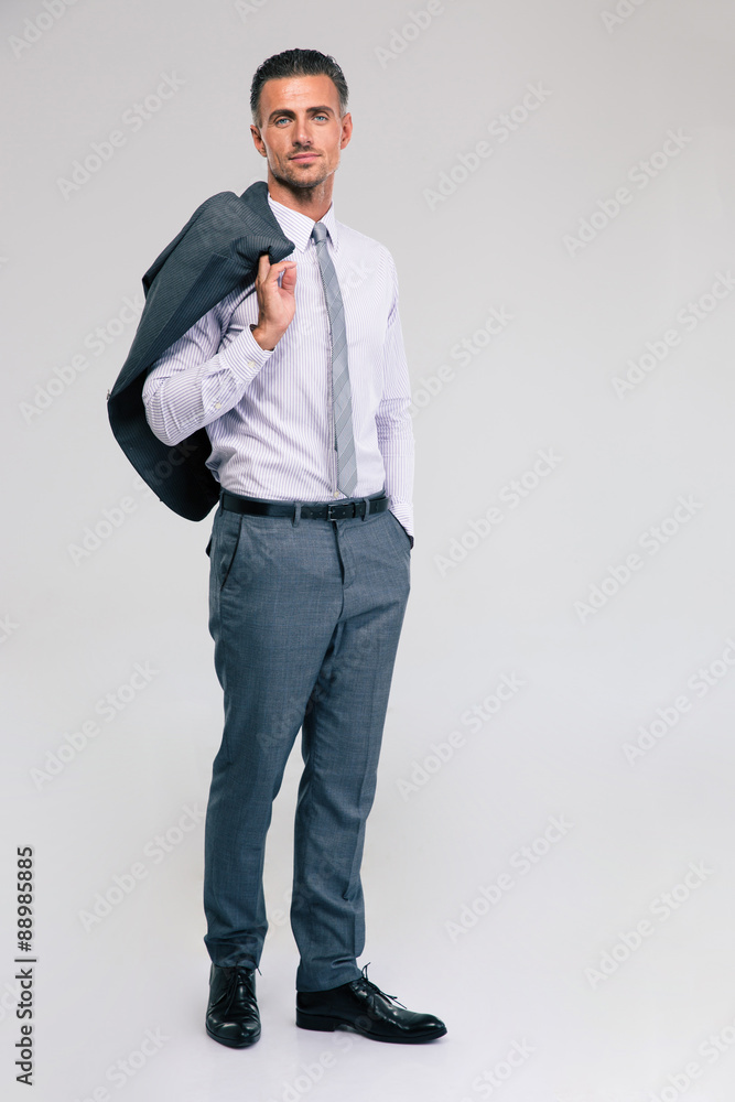 Businessman standing with jacket on shoulder Businessman standing with jacket on shoulder