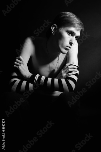 Black and white portrait of a young lonely man