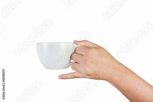 hand holding white mug isolated on white background
