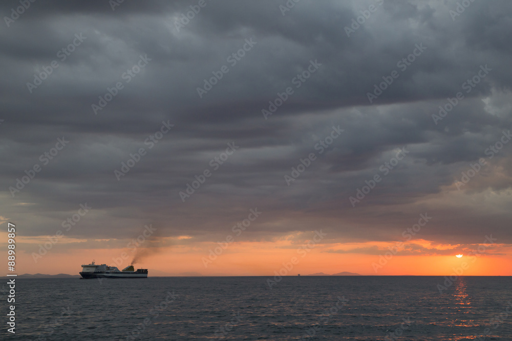 ship sunset, clouds, rain, in Patra Greece