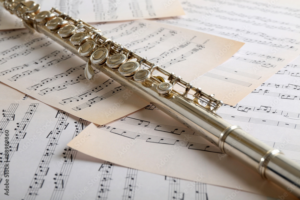 Flute on music notes background Stock Photo | Adobe Stock