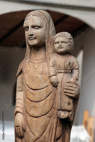 Ancient medieval wooden statue of the Madonna with child