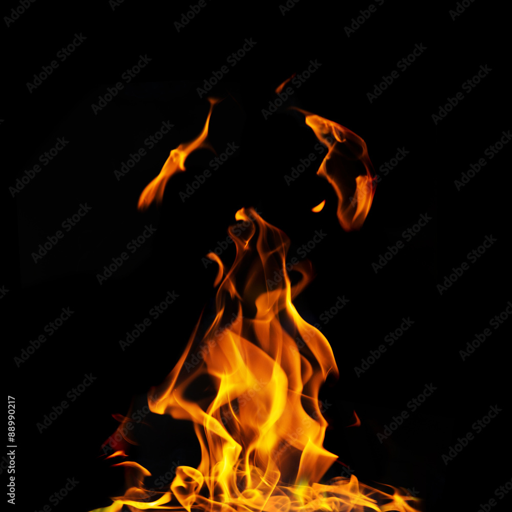 single fire flame on black background in high resolution. single fire flame on black background in high resolution.