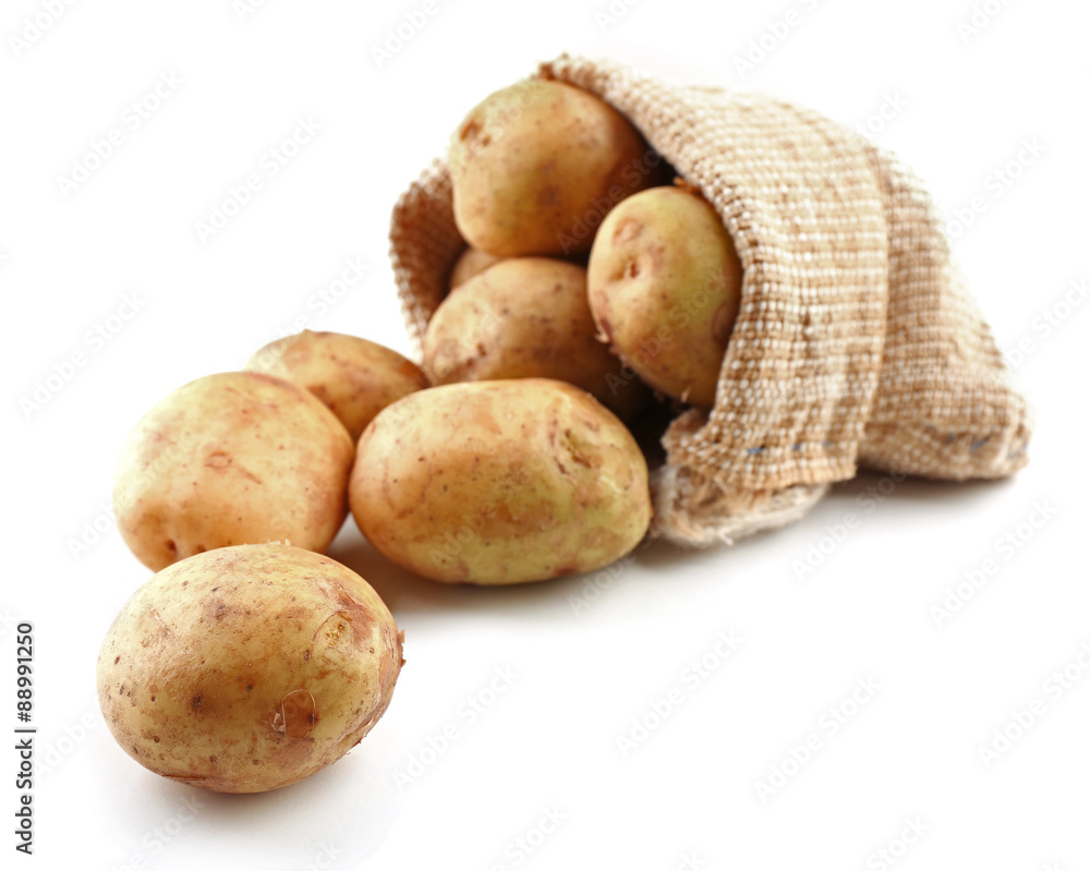 Young potatoes in sackcloth bag isolated on white Young potatoes in sackcloth bag isolated on white