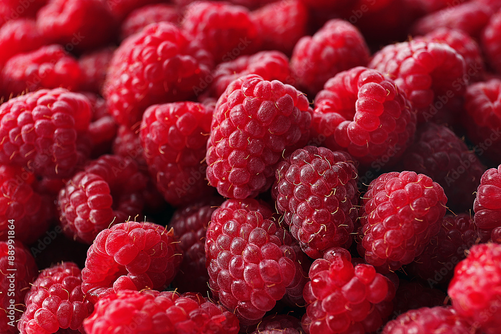 Heap of sweet red raspberries close up Heap of sweet red raspberries close up