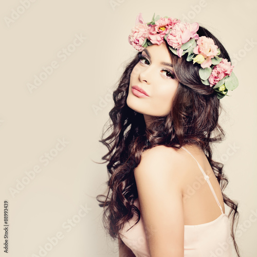 Beautiful Woman with Curly Hair, Makeup and Flowers Wreath