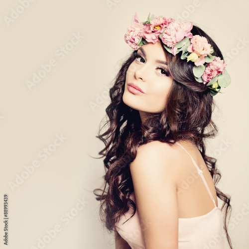 Obraz na plátně Beautiful Woman with Curly Hair, Makeup and Flowers Wreath