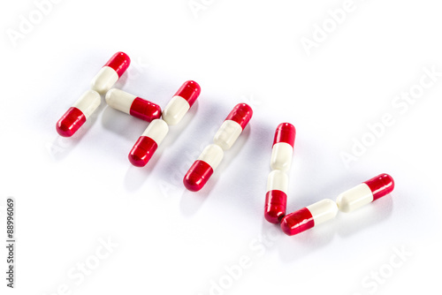 Фотография red with white capsule in HIV WORD, AIDS