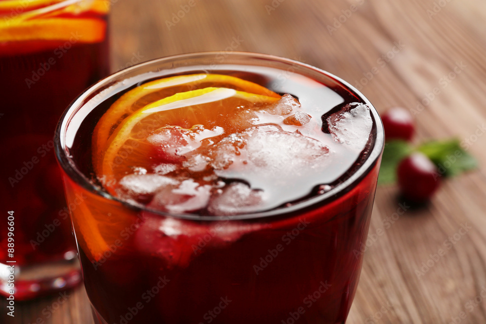 Glasses of cherry juice on wooden table, closeup Glasses of cherry juice on wooden table, closeup