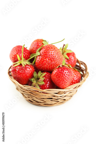 Strawberries in basket isolated on a white