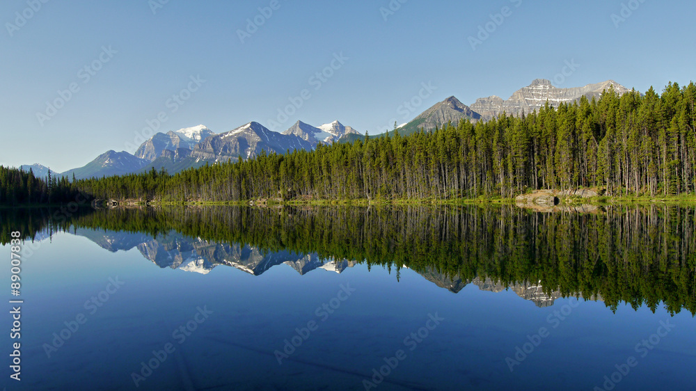 Mountains reflected in the lake. Canadian Rocky Mountains