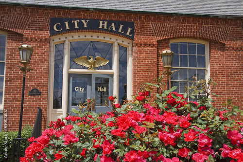 Photo City Hall Brick Building with Knock Out Roses in Foreground