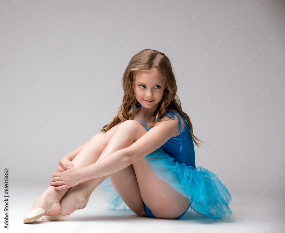 Naklejka premium Nice little ballerina smiling at camera