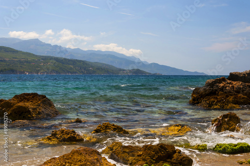 Cobalt blue Aegean sea, mountains and rocks on the island of Samos, Greece