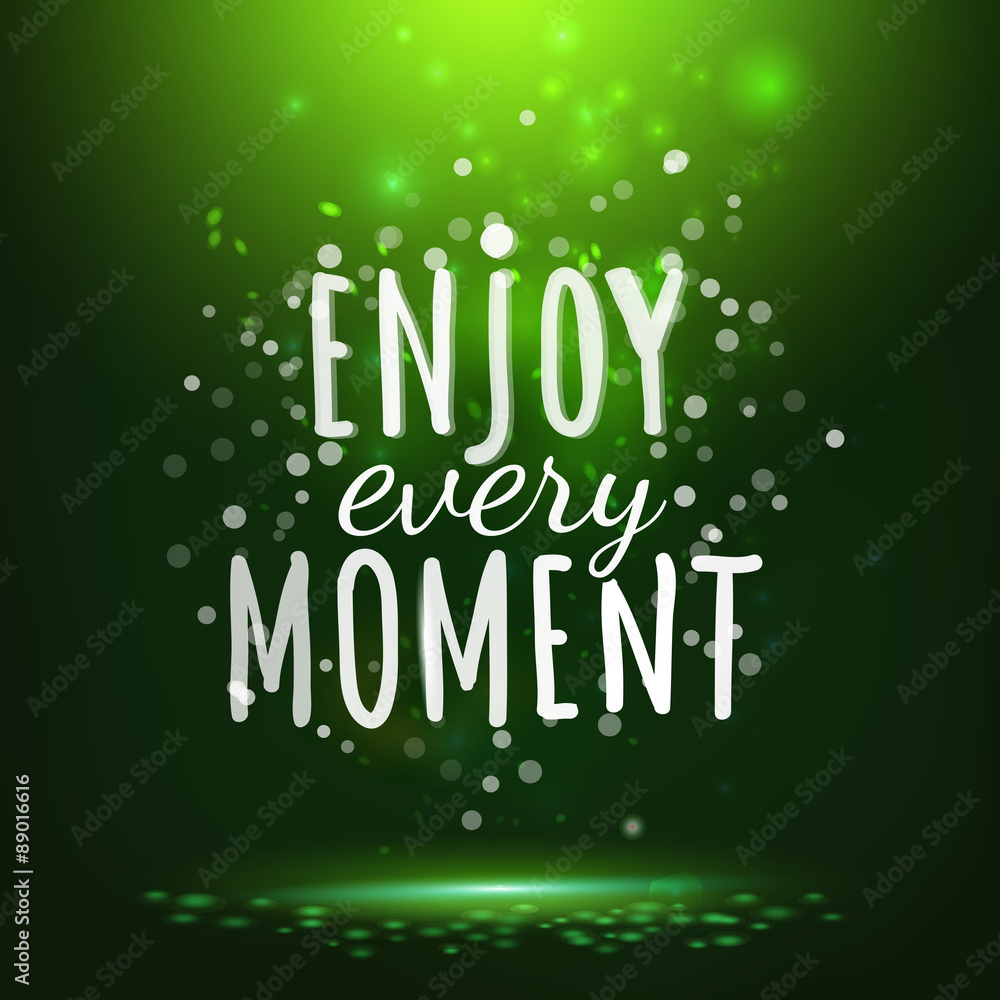 Enjoy every moment drawing lettering at green backdrop